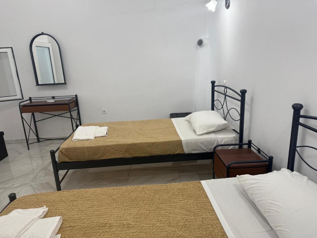 Postel nebo postele na pokoji v ubytování Hotel Hellas