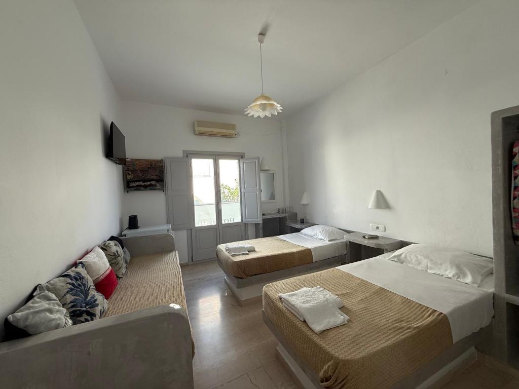 Postel nebo postele na pokoji v ubytování Hotel Hellas
