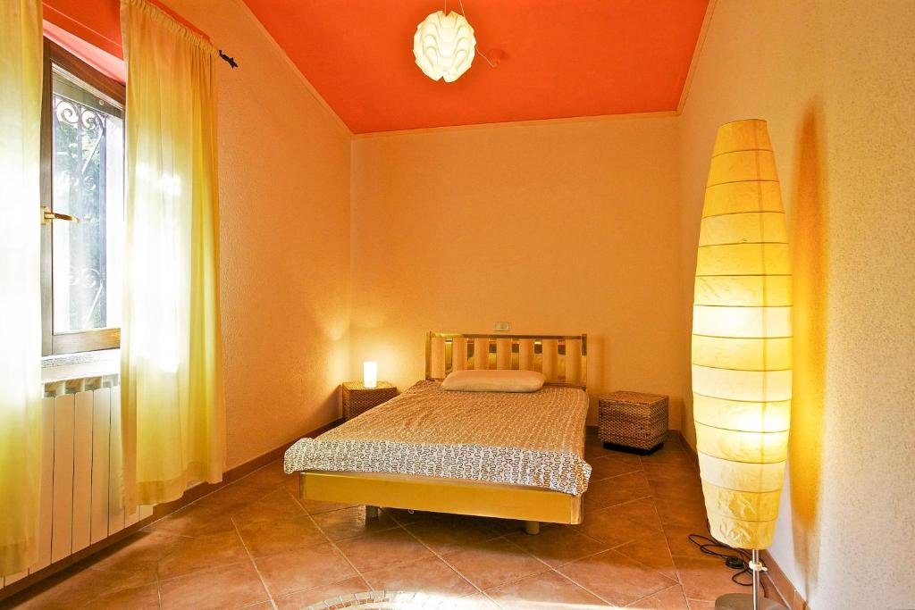 Łóżko lub łóżka w pokoju w obiekcie Casa La Campanella