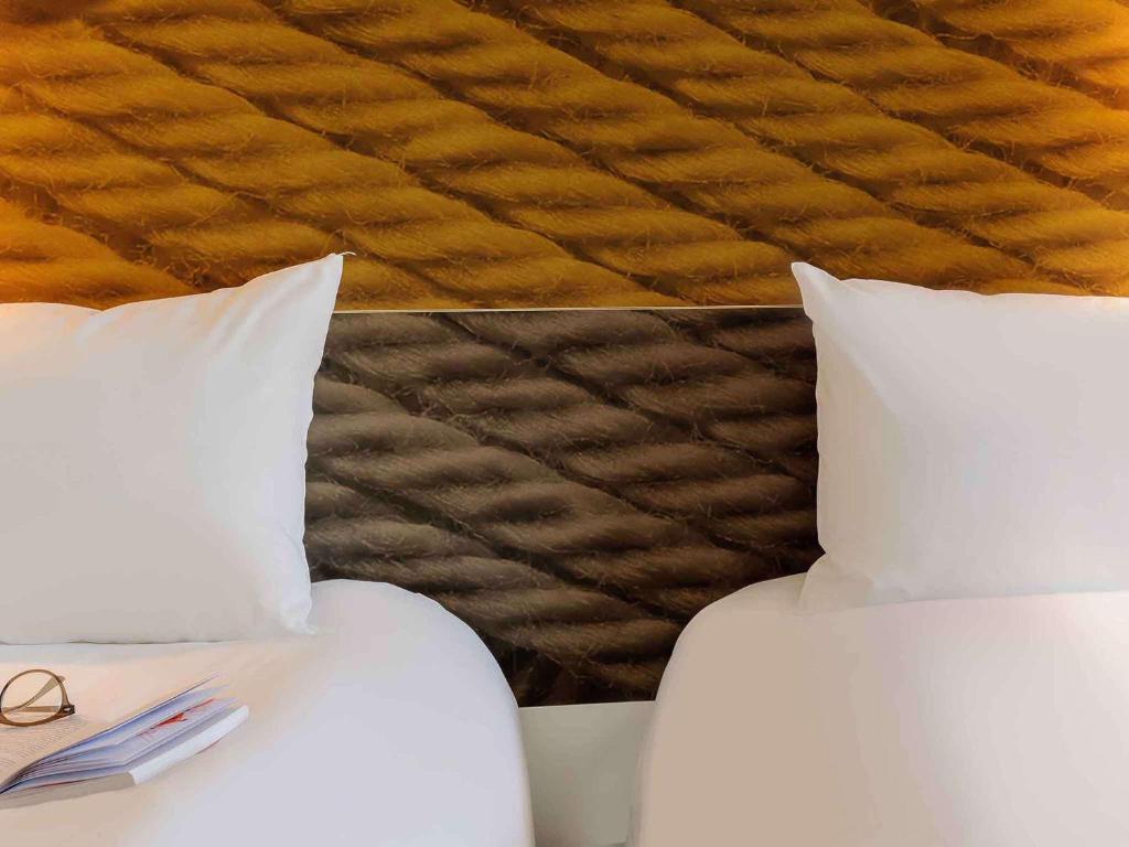 A bed or beds in a room at ibis Wien Hauptbahnhof