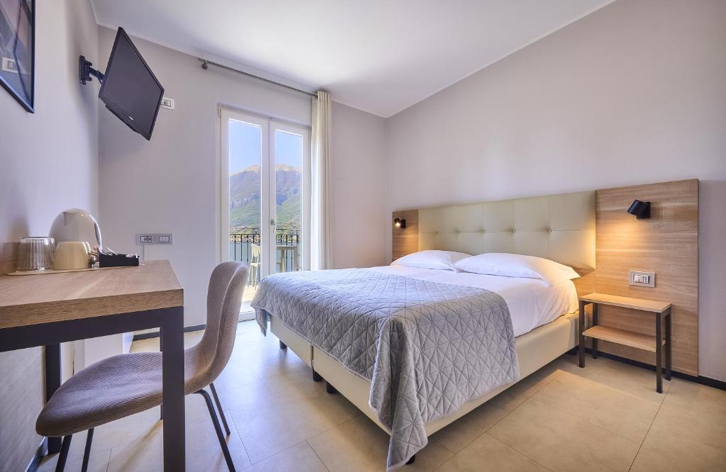 Postel nebo postele na pokoji v ubytování Albergo Silvio