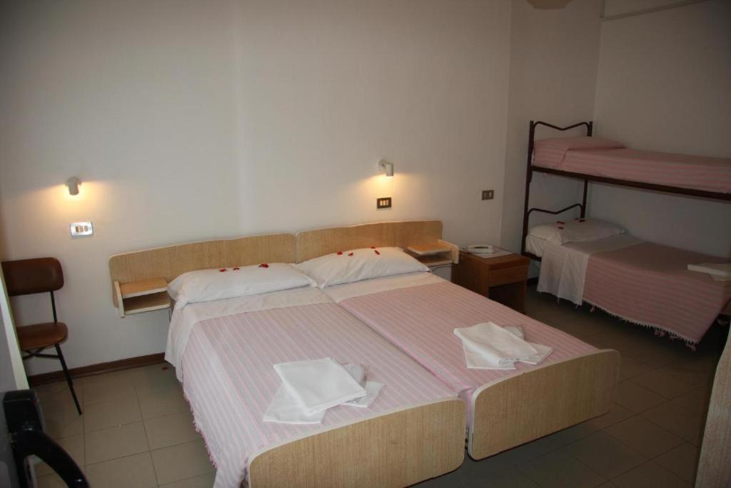 Postel nebo postele na pokoji v ubytování Hotel Orchidea