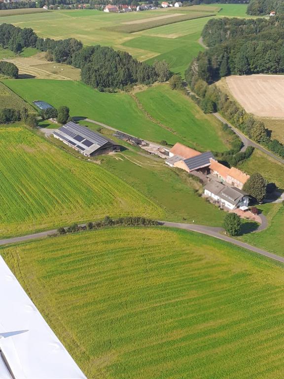 an aerial view of a farm from an airplane at Ferienwohnung Burkart in Ebersburg
