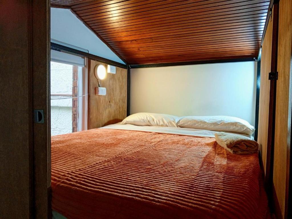 Postel nebo postele na pokoji v ubytování Ayllu Hostel