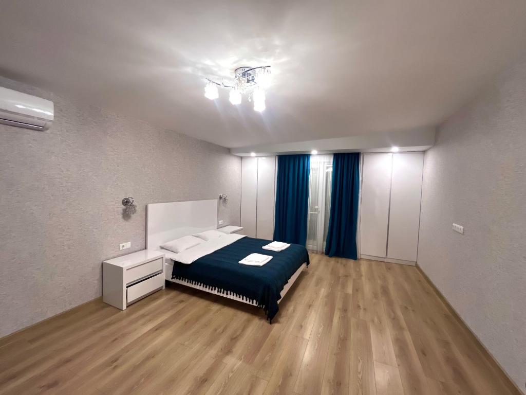 Postel nebo postele na pokoji v ubytování Guest House Bagrationi