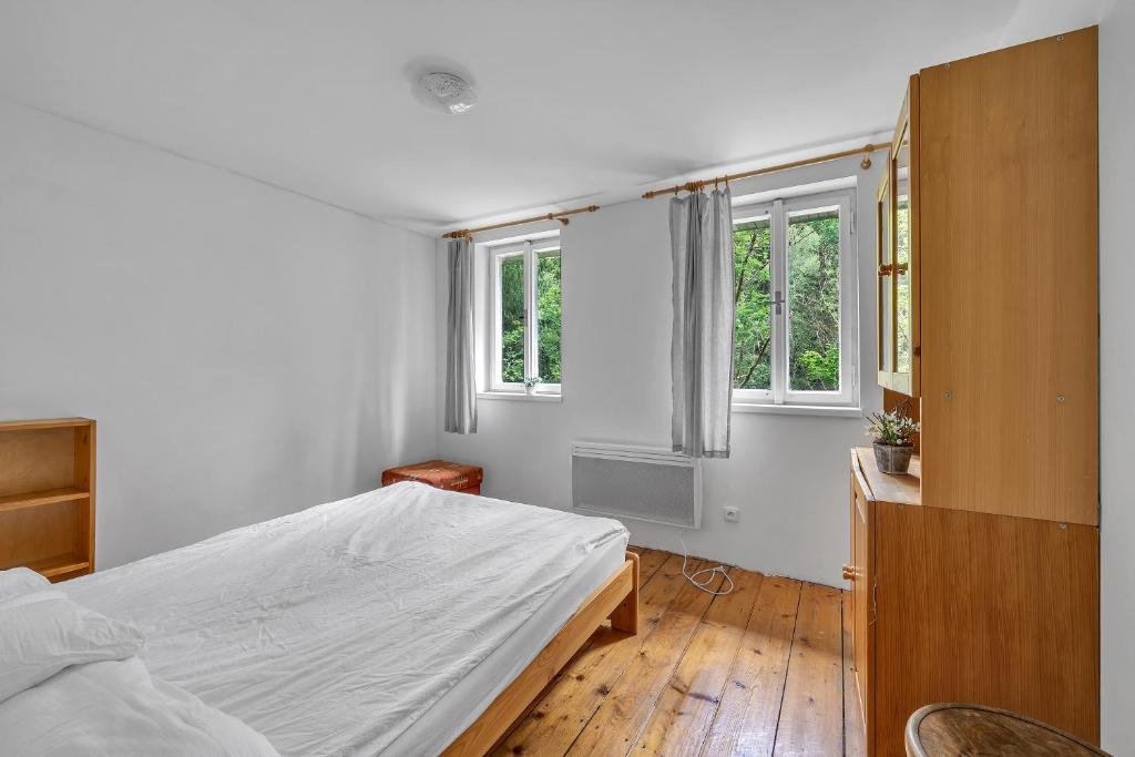 Postel nebo postele na pokoji v ubytování Apartmán pod Mariánskou horou