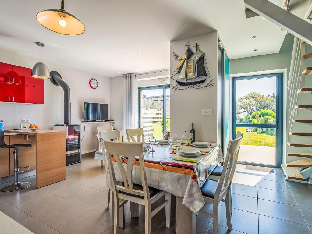 a kitchen and dining room with a table and chairs at Holiday Home Ty Angèle by Interhome in Plouescat