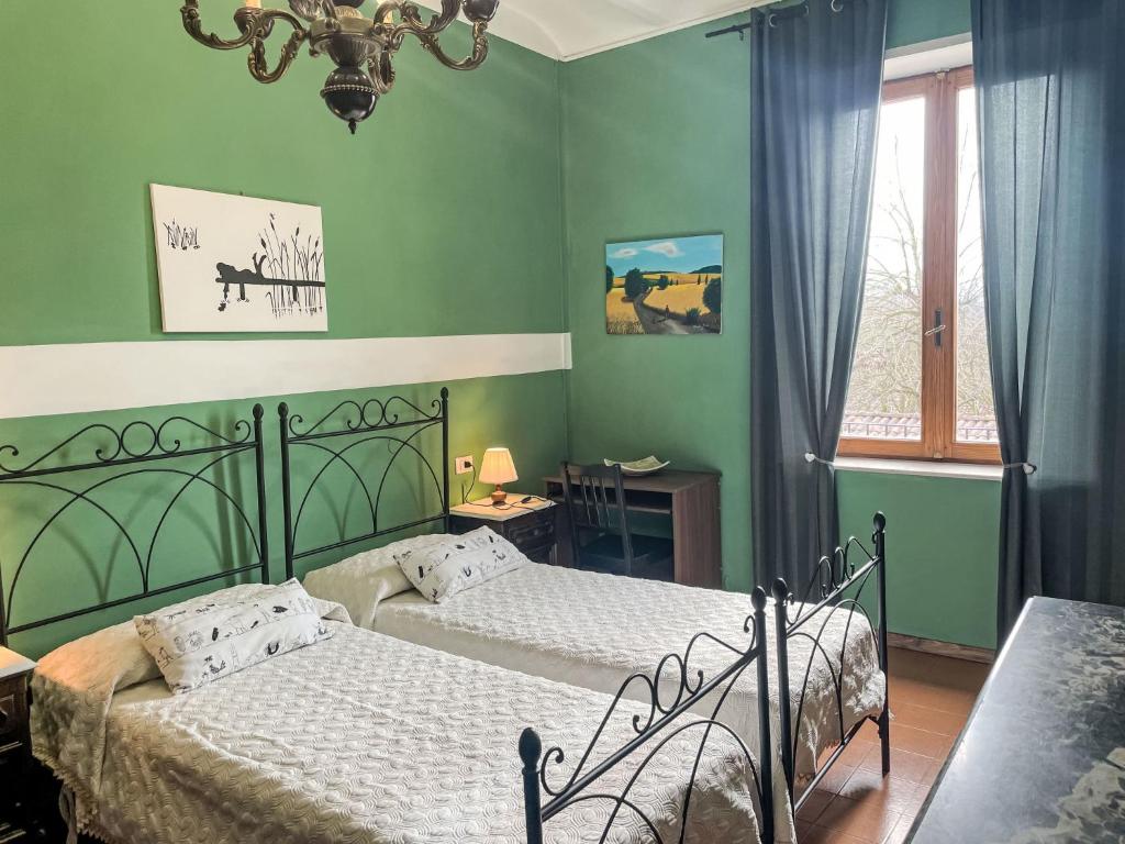 Posteľ alebo postele v izbe v ubytovaní Holiday Home Il Cavaliere by Interhome