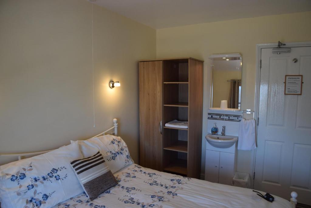 Postel nebo postele na pokoji v ubytování Kingsleigh Guest House