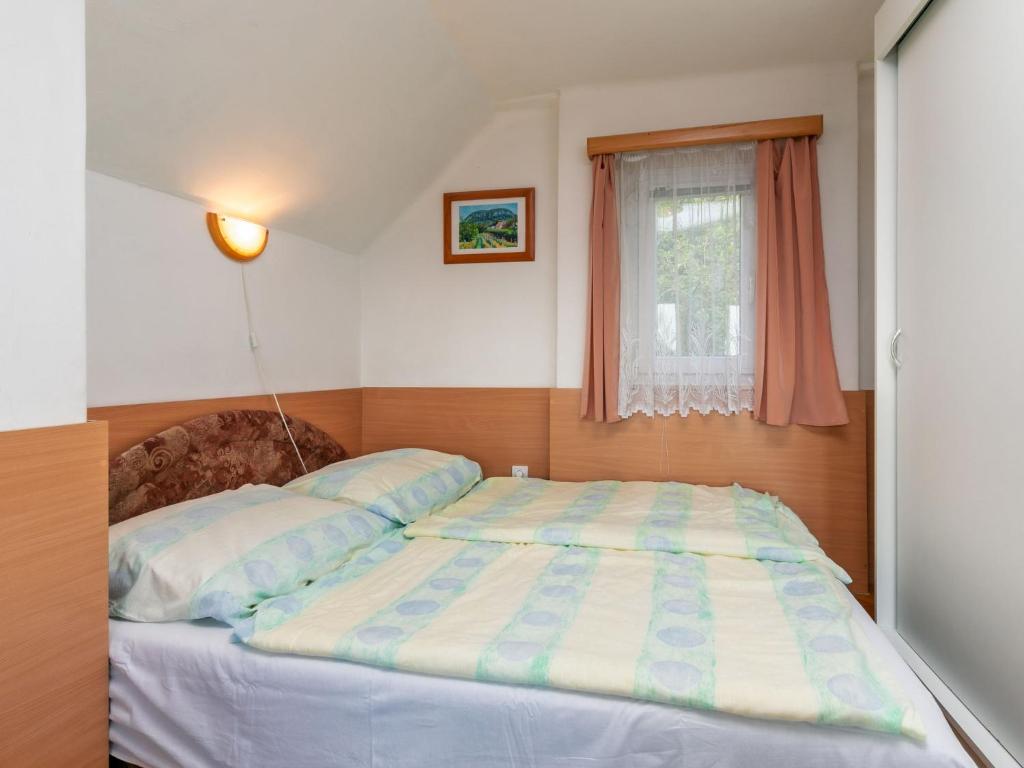Postel nebo postele na pokoji v ubytování Holiday Home Kopacsi by Interhome