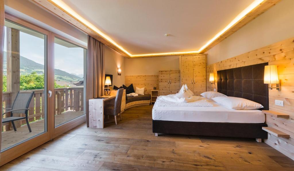 Voodi või voodid majutusasutuse Naturhotel Sonnenhof toas