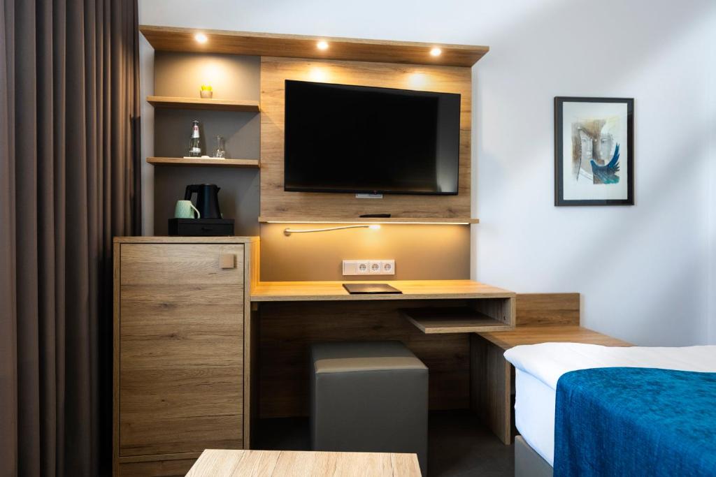 TV a/nebo společenská místnost v ubytování Hotel Logotel