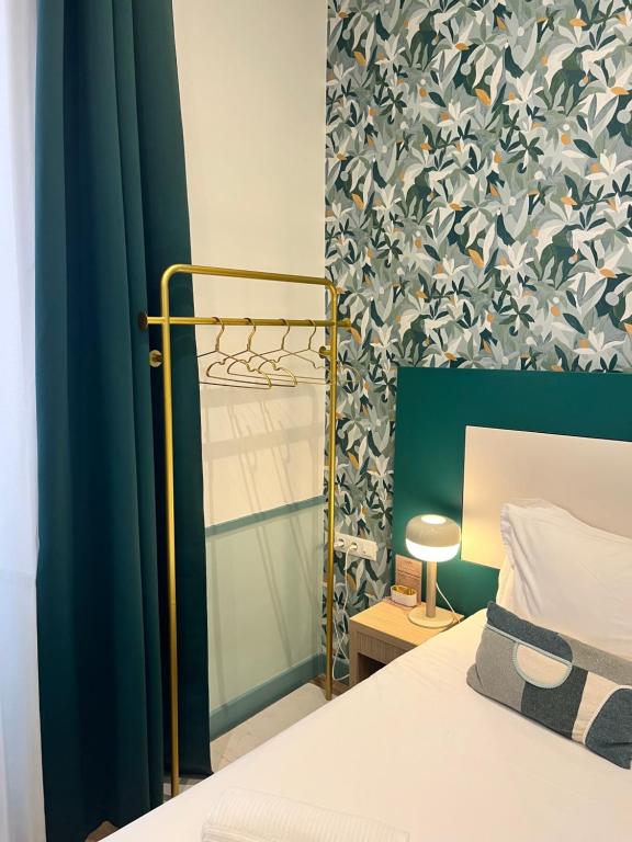 Postel nebo postele na pokoji v ubytování Hôtel De Londres