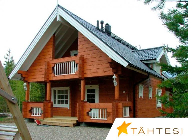 duży drewniany dom z dachem gambrel w obiekcie Loma Rinteelä w mieście Suonenvaara