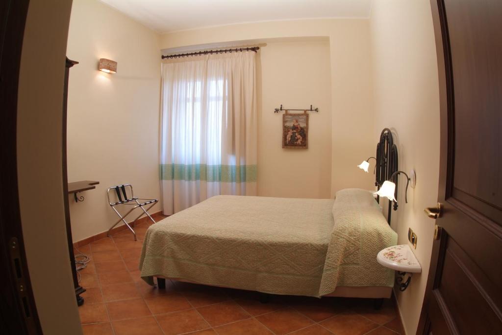 Postel nebo postele na pokoji v ubytování Agriturismo La Casa Di Botro