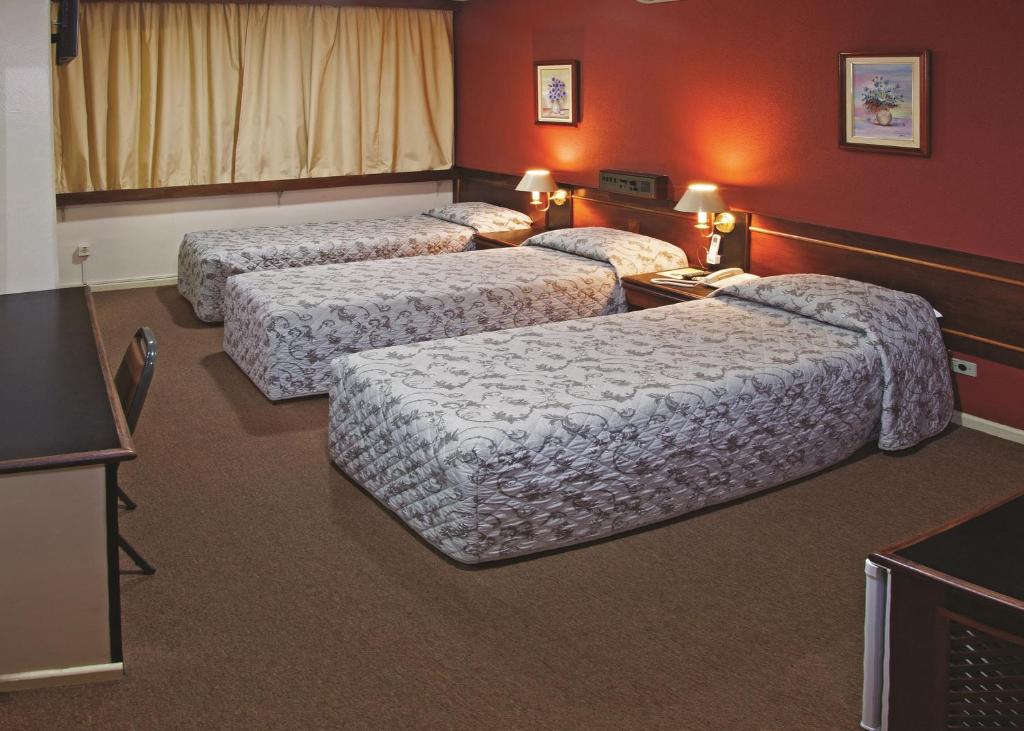 Postel nebo postele na pokoji v ubytování Lira Hotel