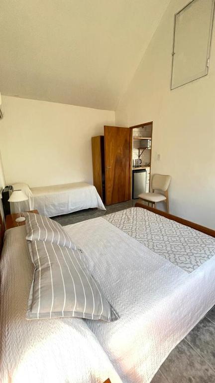 Ein Bett oder Betten in einem Zimmer der Unterkunft Bungalows Bella Vista