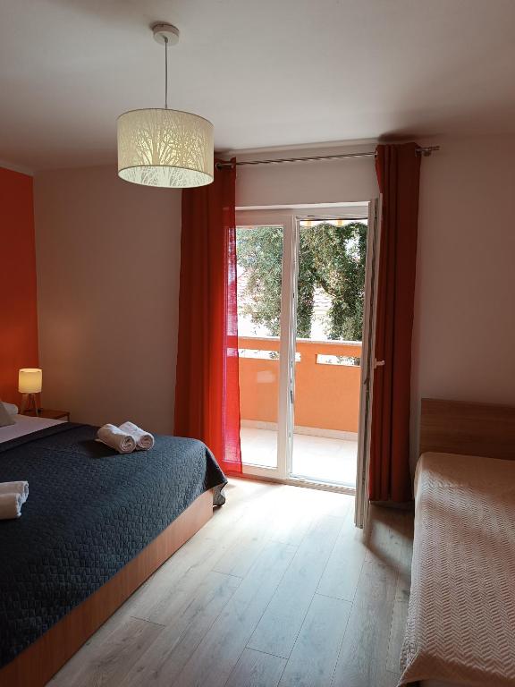 Posteľ alebo postele v izbe v ubytovaní Apartments Mirjana Baška