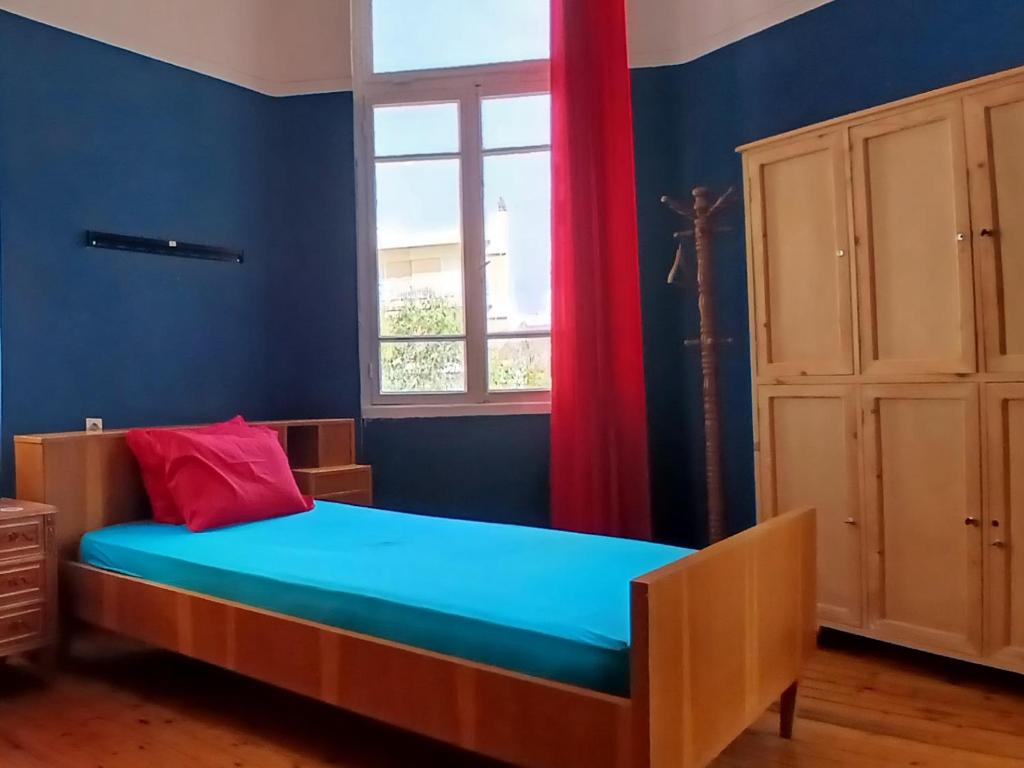 Postel nebo postele na pokoji v ubytování Doukas Hostel Room