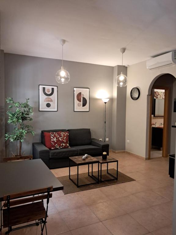 a living room with a couch and a table at Apartamento Ataraxia in Ronda