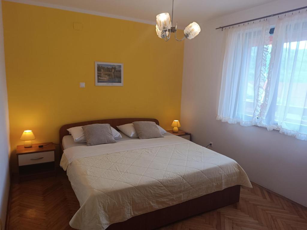 Posteľ alebo postele v izbe v ubytovaní Apartments Mirjana Baška