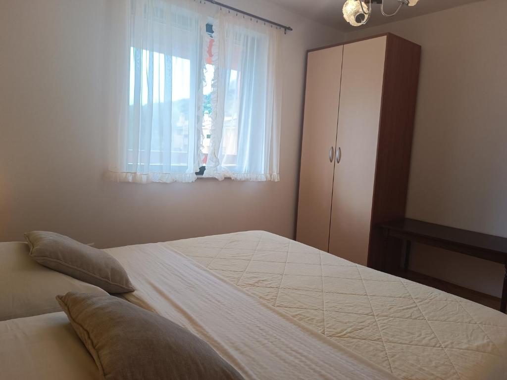 Posteľ alebo postele v izbe v ubytovaní Apartments Mirjana Baška