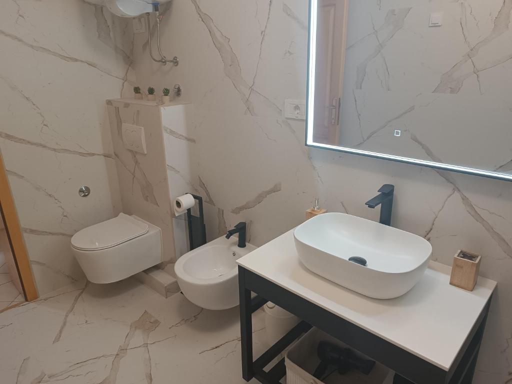 Kúpeľňa v ubytovaní Apartments Mirjana Baška