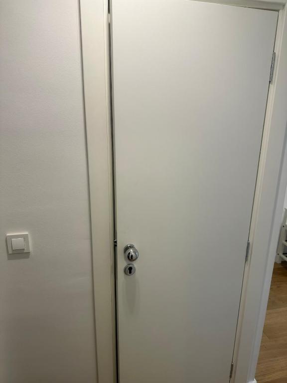 a white door with a silver door knob at Apartment DB in Split