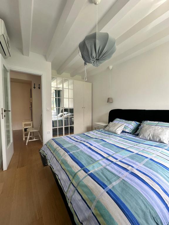 a bedroom with a large bed and a ceiling at Apartment DB in Split