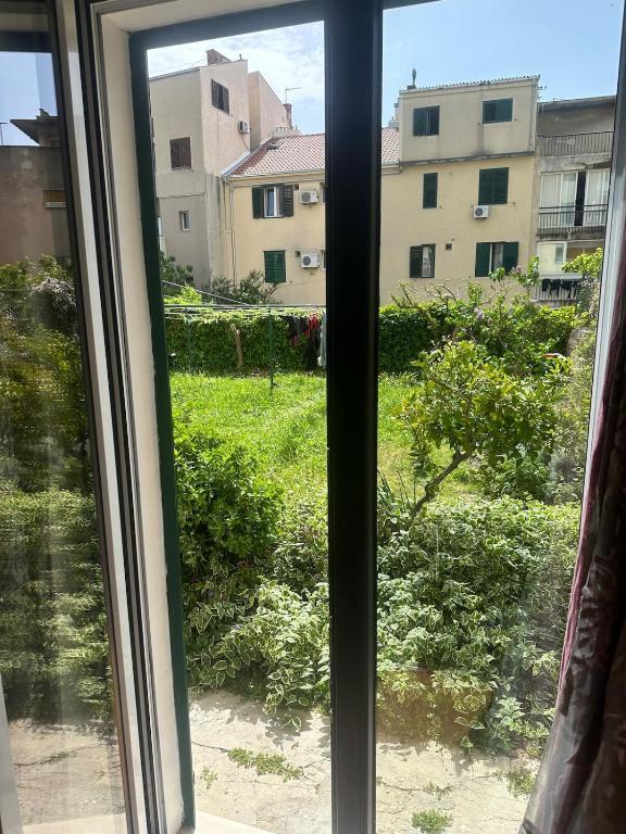 a window with a view of a yard at Apartment DB in Split