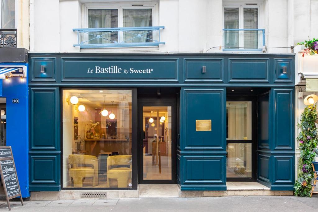 a blue storefront of a furniture store at Le Bastille By Sweett in Paris
