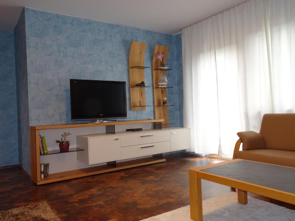 TV a/nebo společenská místnost v ubytování Ferienwohnung Mühlengrün
