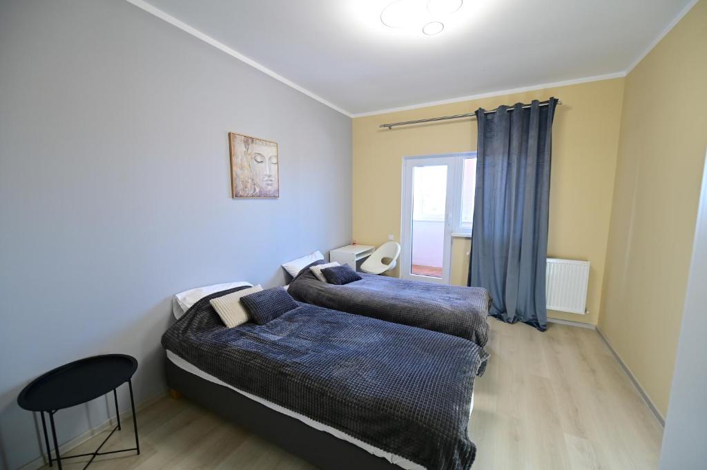 Un pat sau paturi într-o cameră la Penthouse View - FLH