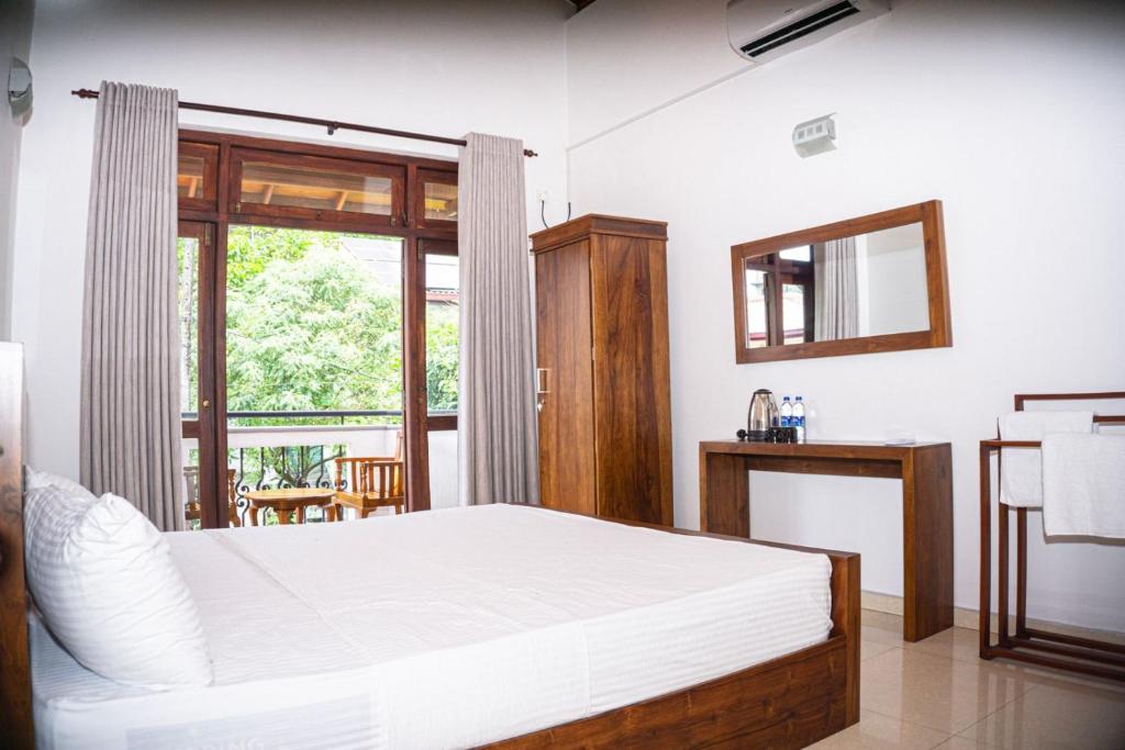 Postel nebo postele na pokoji v ubytování Urban Villas, Kotte