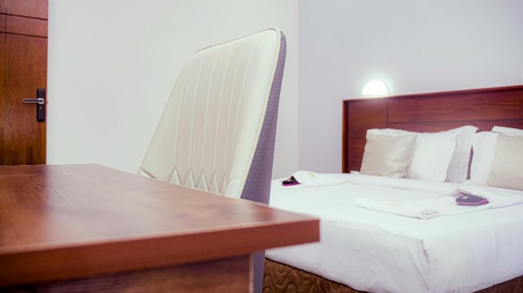 Postel nebo postele na pokoji v ubytování COFE Hôtel