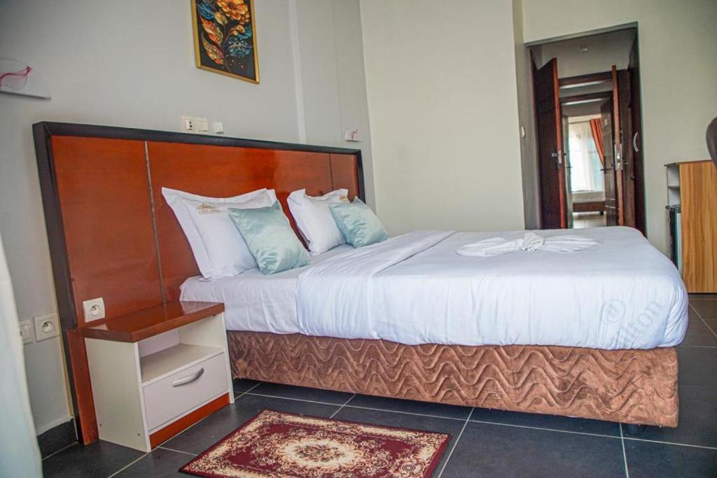 Postel nebo postele na pokoji v ubytování COFE Hôtel