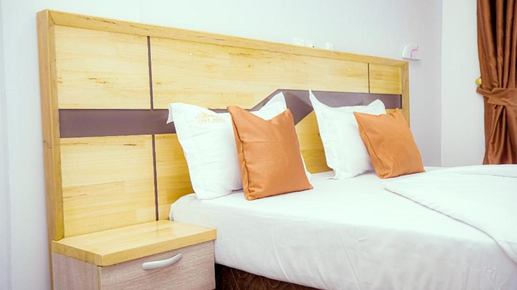 Postel nebo postele na pokoji v ubytování COFE Hôtel