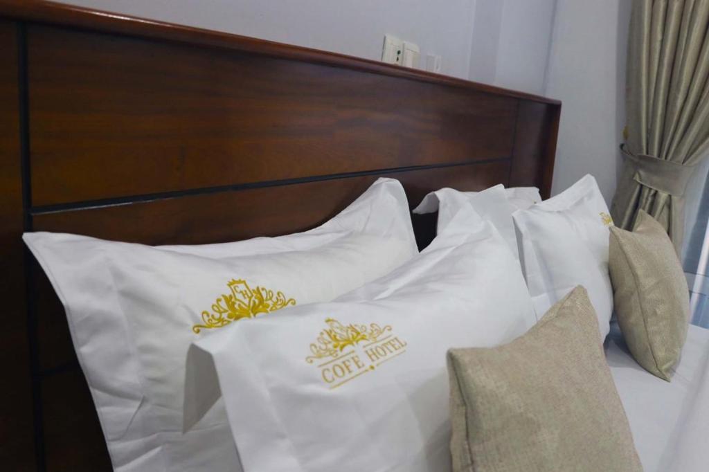 Postel nebo postele na pokoji v ubytování COFE Hôtel