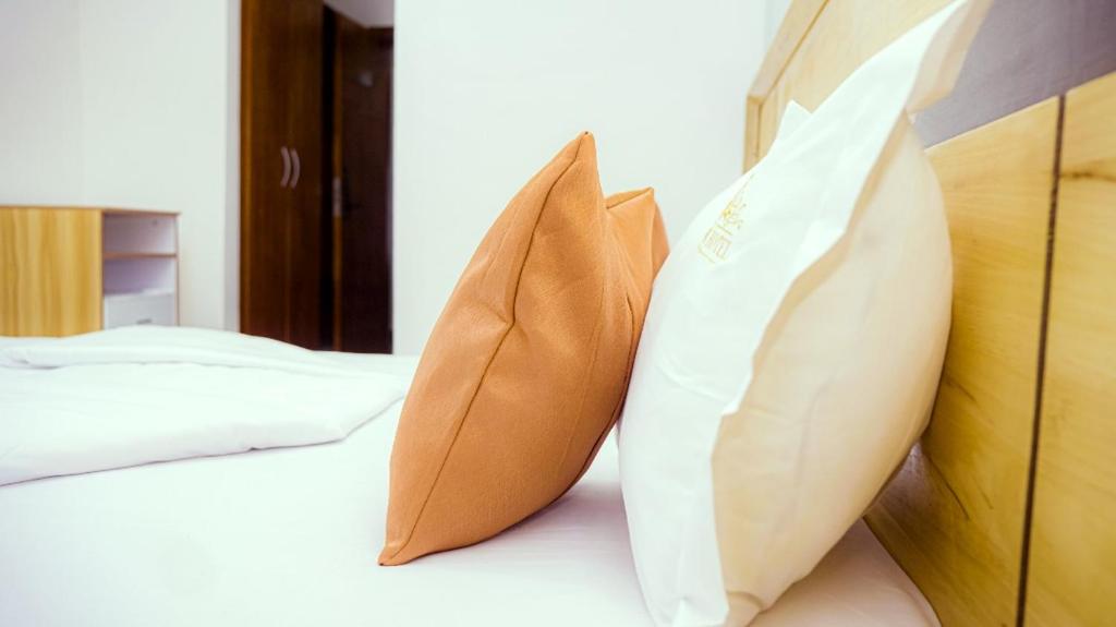 Postel nebo postele na pokoji v ubytování COFE Hôtel