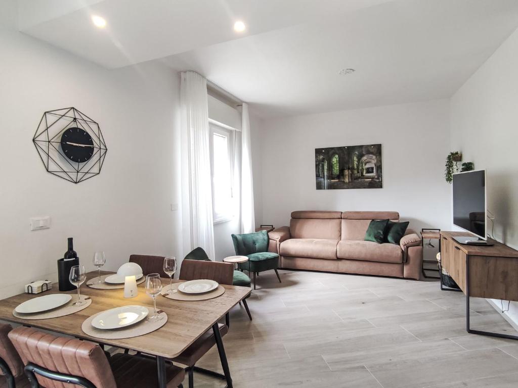 a living room with a table and a couch at Apartment Nonnellini by Interhome in Trento