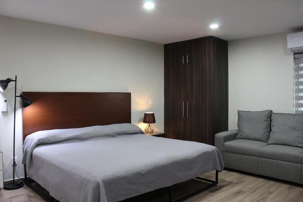 Postel nebo postele na pokoji v ubytování Lofts Las Fuentes
