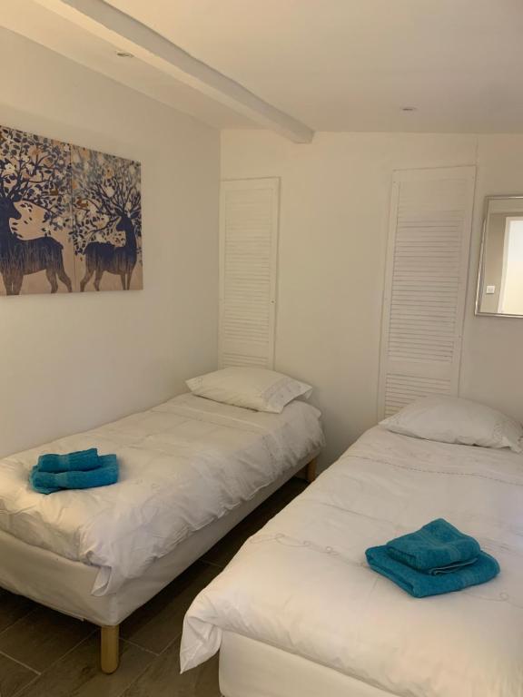 Ein Bett oder Betten in einem Zimmer der Unterkunft Le Petit Chene