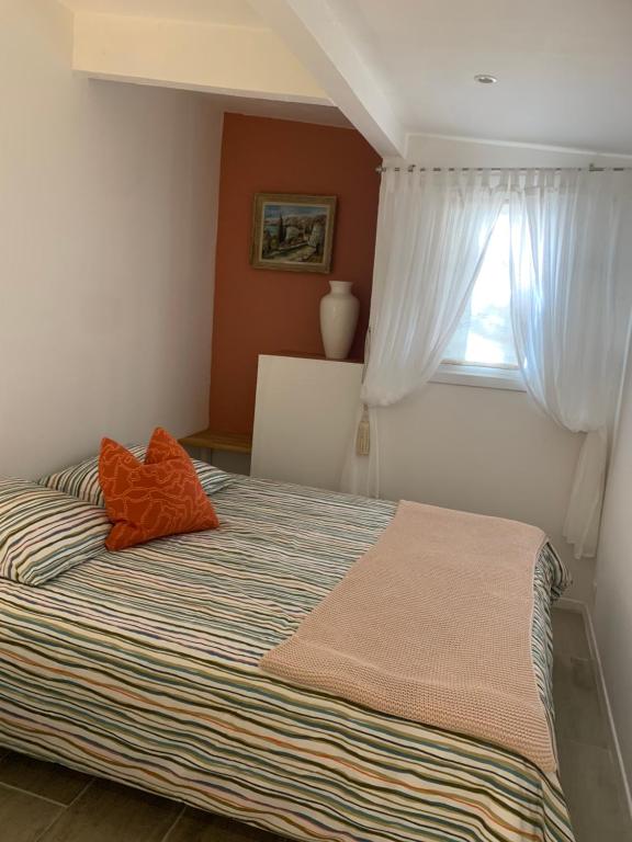 Ein Bett oder Betten in einem Zimmer der Unterkunft Le Petit Chene