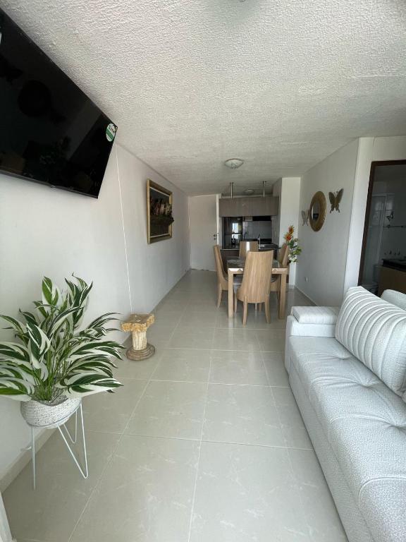 a living room with a couch and a table at Cacique Travels in Bucaramanga