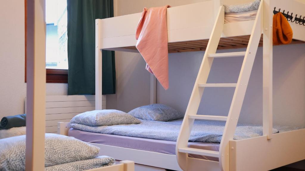 Postel nebo postele na pokoji v ubytování Backpacker Le Petit Baroudeur