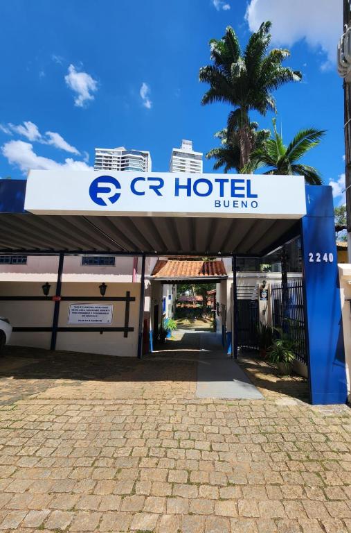a sign for a hotel in front of a building at CR Hotel Bueno in Goiânia