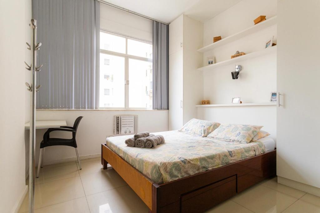 Giường trong phòng chung tại SUH Copacabana 36 Confort Sun