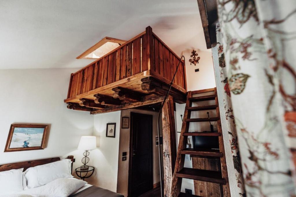 Postel nebo postele na pokoji v ubytování Locanda La Brenva - Estella Hotel Collection & Experience