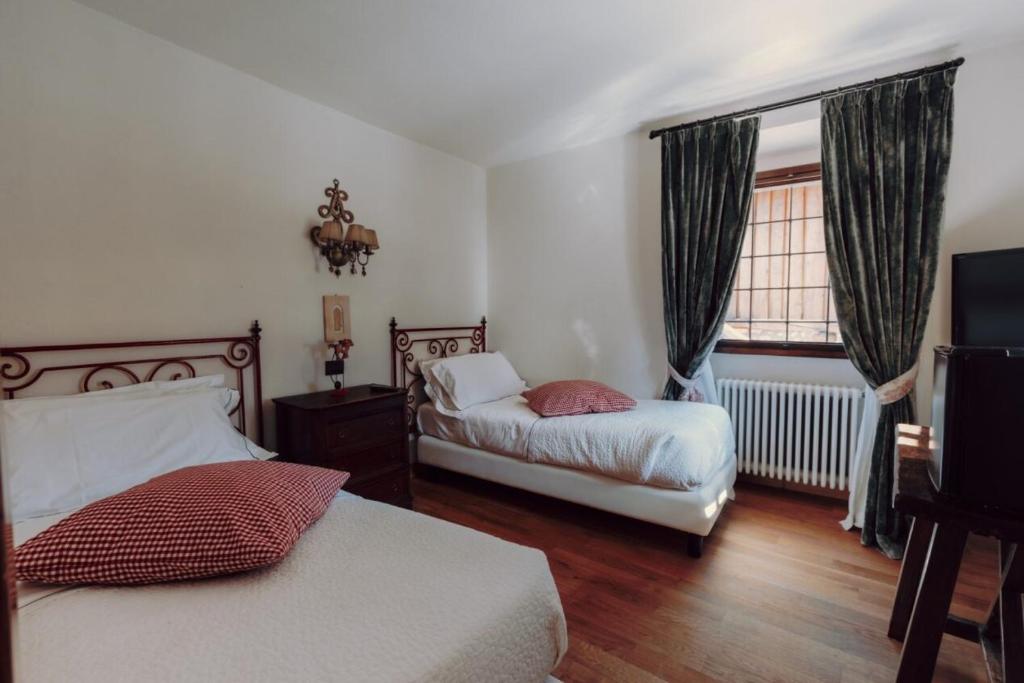 Postel nebo postele na pokoji v ubytování Locanda La Brenva - Estella Hotel Collection & Experience
