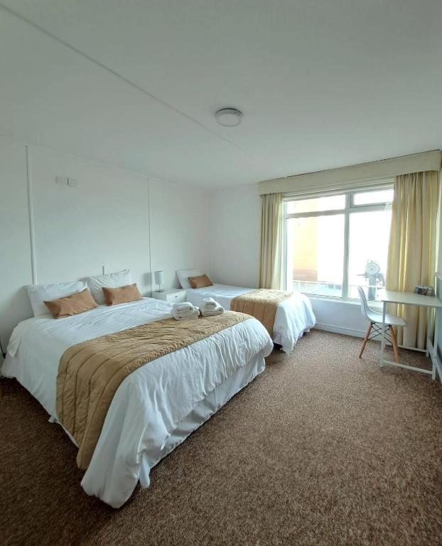 Una cama o camas en una habitación de Hotel Capitán Eberhard